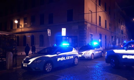 Police cars on a dark street in Rome