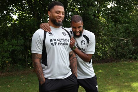 Kazim-Richards and his assistant, Julian Gray, share a joke on the training ground