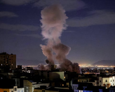A smoke plume rises following a missile strike on a building in Tehran amid ongoing strikes by the US and Israel on Iran. Follow live for latest updates.