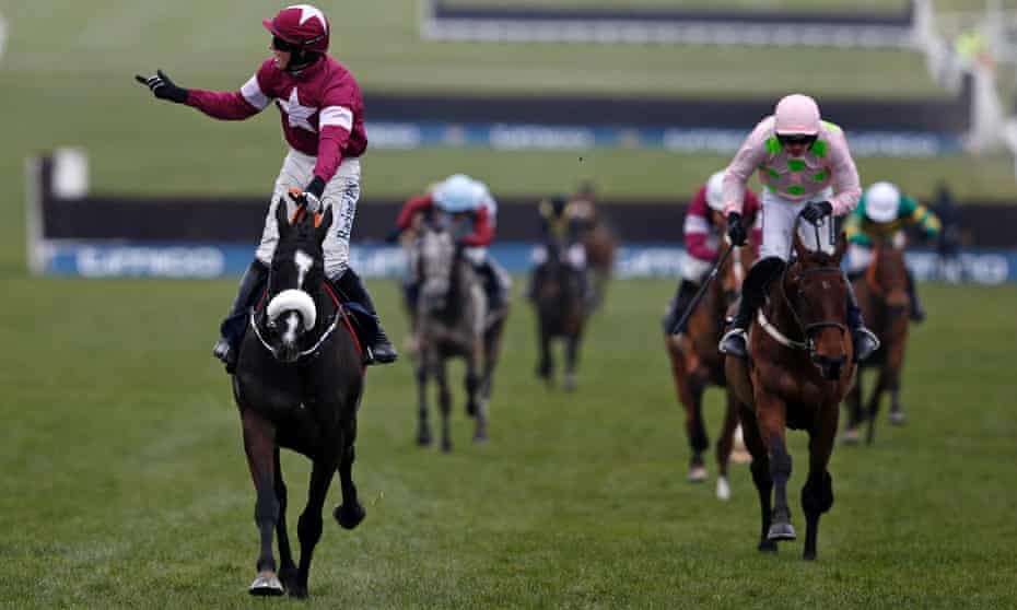 Bryan Cooper, left, celebrates on Don Cossack after his victory over Ruby Walsh and Djakadam in the Cheltenham Gold Cup on the final day of the Festival meeting.
