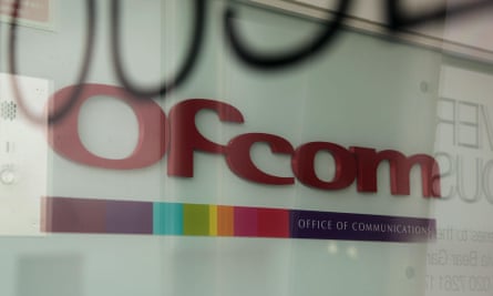 The Ofcom logo seen through an office window