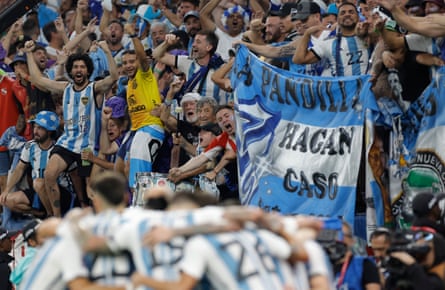 Argentina fans and players celebrate after their second goal, scored by Julián Álvarez, during their last sixteen match against Australia.