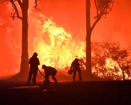 Firefighters near Termeil north of Narooma in December 2019.