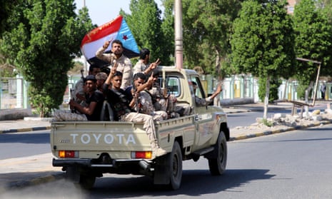 Southern Yemeni separatist fighters flash the V sign as they ride through Aden’s streets on Monday.