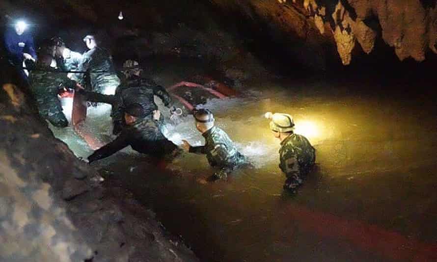 A team of Royal Thai Navy SEAL divers inspecting the water-filled tunnel in the Tham Luang cave.