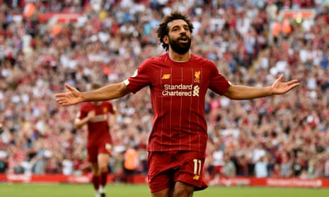Mohamed Salah celebrates after scoring the third for Liverpool.