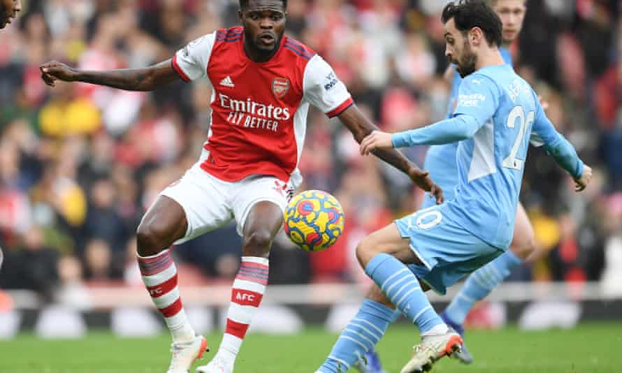 Arsenal's Thomas Partey challenges Man City's Bernardo Silva