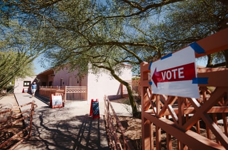 A red âÂÂVoteâ sign hangs on a wooden fence outside a Scottsdale voting centre