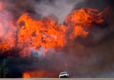Firestorm … an abandoned truck on Alberta Highway 63 near Fort McMurray.