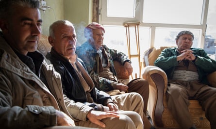Former Peshmerga (Iraqi Kurdish armed forces) discuss the region’s tumultuous history in a social club in Sheladze.