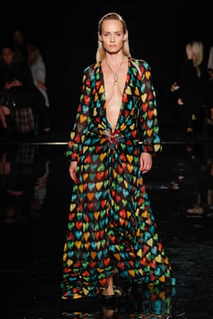 Model Amber Valletta walks the runway in a recreation of Jennifer Lopez’s dress for the 2000 Grammys.
