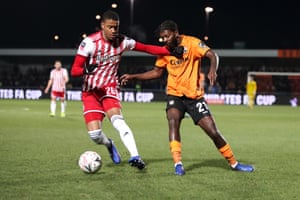 Brentford's Ezri Constance protects Ball from Medite Elito from Barnett.