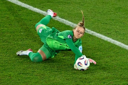 England goalkeeper Hannah Hampton dives to save a penalty from Filippa Angeldal in the chaotic penalty shootout.