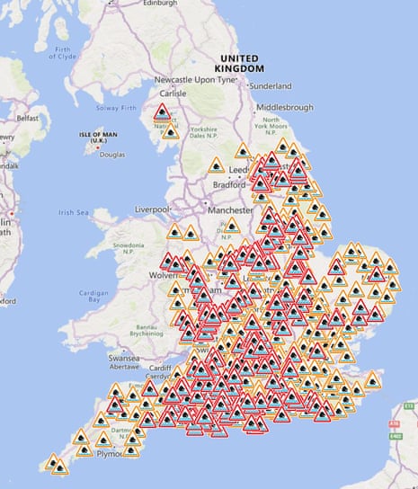 A map of England and Wales showing flood warning symbols