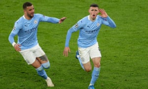 Manchester City's Phil Foden (R) celebrates after scoring the 2-1 with Manchester City's Kyle Walker during the UEFA Champions League quarter final, second leg soccer match between Borussia Dortmund and Manchester City