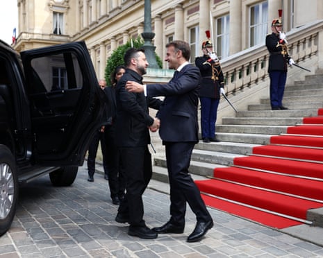 French president Emmanuel Macron shakes hands with Ukrainian president Volodymyr Zelenskyy