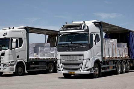 Two lorries parked with blue sky above