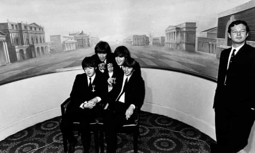 Brian Epstein with the Beatles in 1965 when they received MBEs at Buckingham Palace