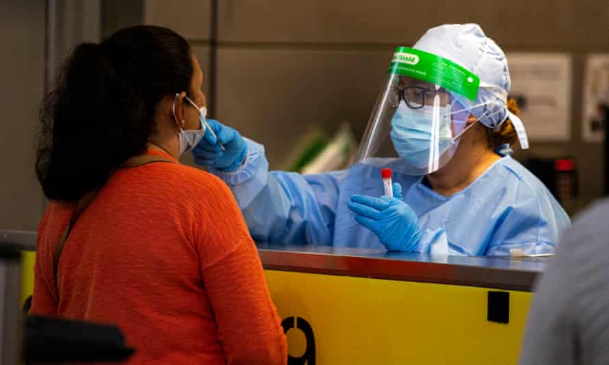 A healthcare worker tests a person for Covid-19 in Los Angeles, California, on 4 February.