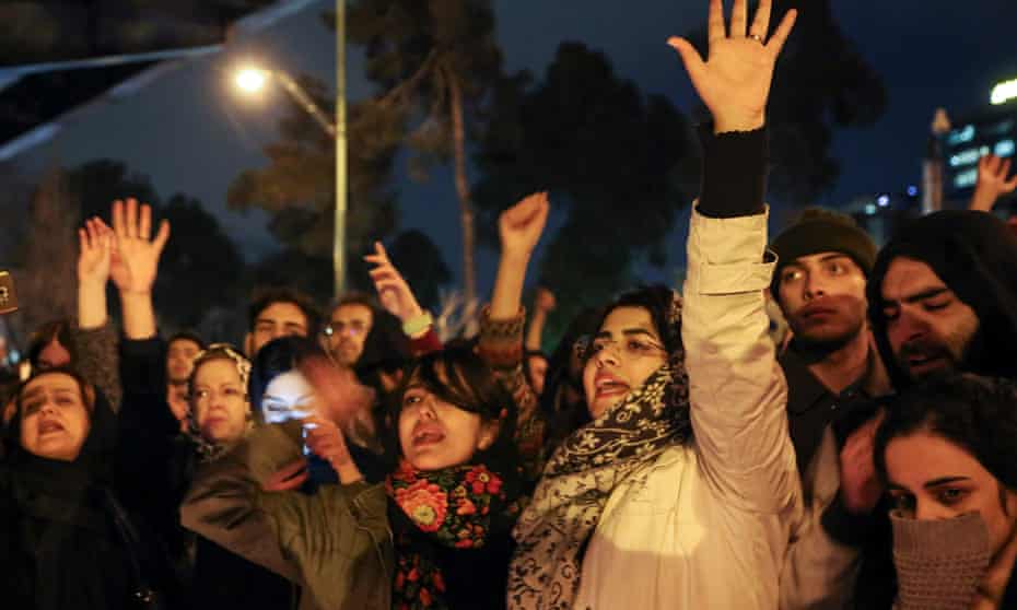 Iranians shout anti-government slogans outside Amirkabir University in Tehran on Saturday after a vigil held for the victims of the Ukrainian plane crash.