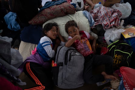 Mexican asylum-seeking girls, who are cousins, rest under a gazebo in a plaza where they have been living for a week in Reynosa, Mexico on March 24, 2021. They were sent back with their mothers after seeking asylum in the U.S. under Title 42 due to the pandemic. Verónica G. Cárdenas for The Guardian