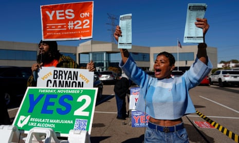 In Ohio, after Issue 1 comes Issue 2 on the ballot: Nikko Griffin, left, and Tyra Patterson, call out to early voters in Cincinnati last week. They urge people to vote for different issues, including Issue 2, which would allow adult-use sale, purchase, and possession of cannabis for Ohioans who are 21 and older.
