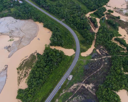 A road cuts through an area deforested by illegal gold mining in the Madre de Dios province of Peru.