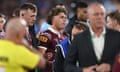 Queensland Maroons fullback Reece Walsh is helped from the field after a high hit from NSW Blues debutant Joseph-Aukuso Sua’ali’i in State of Origin Game 1.