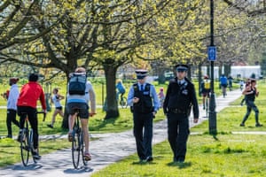 Police patrol Clapham Common in London and remind people of the need for social distancing
