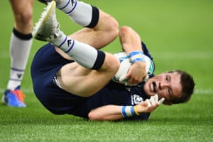 Scotland's George Horne scores their fourth try .