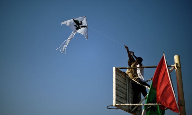 Boys fly a kite bearing the symbol of Burundi’s ruling CNDD-FDD party during a rally last week.