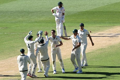 Australia’s Pat Cummins celebrates the wicket of Pakistan’s Aamer Jamal with his teammates