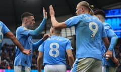 Erling Haaland celebrates with Phil Foden after scoring Manchester City’s second goal against Wolves.