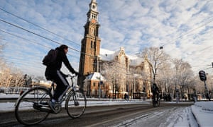 Cyclists in Amsterdam: ‘The Netherlands and Denmark have spent decades deliberately re-shaping their road environments away from the car culture of the 1960s and 70s towards mass cycling.’