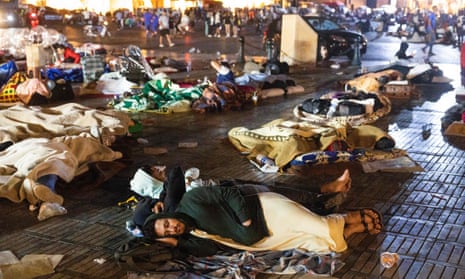 Residents take shelter in a square,
