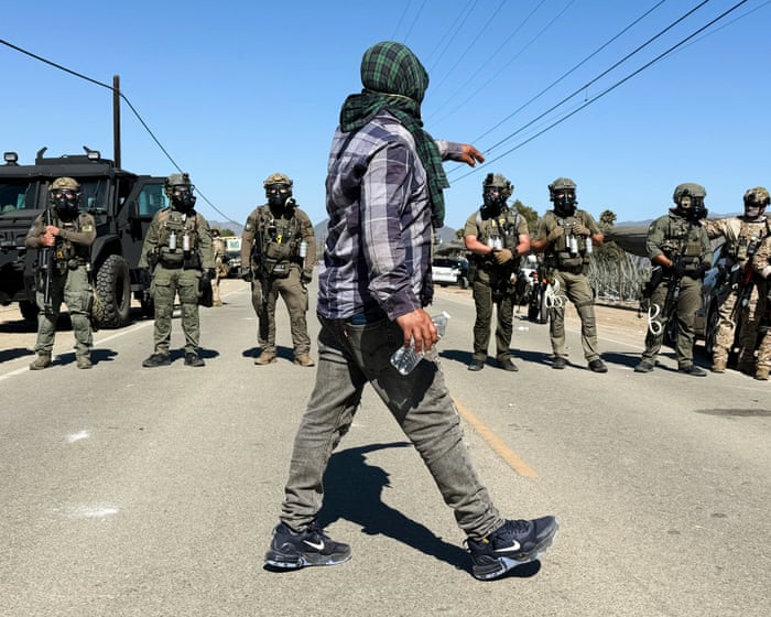 Protesters and US federal agents clash during immigration raid at California farm – video