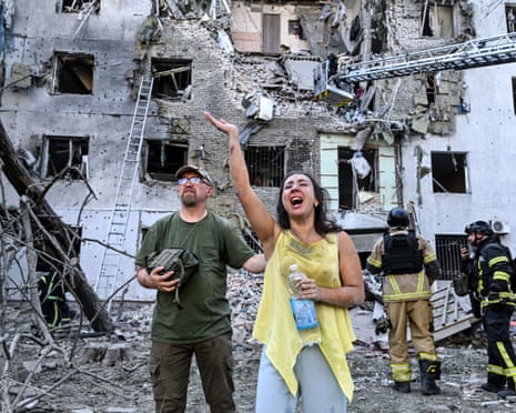 A resident who survived after a Russian bomb struck her building, cries out as the search continues for her 11-year-old daughter in Zaporizhzhia, Ukraine, 19 July 2026.