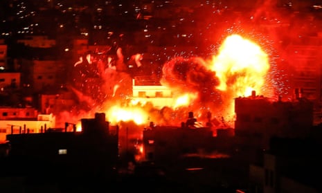 A ball of fire above the building housing the Hamas-run television station al-Aqsa TV in the Gaza Strip during an Israeli airstrike