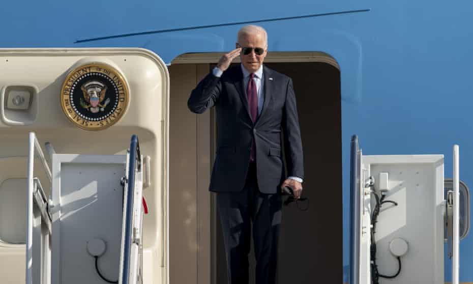 President Joe Biden returns a salute as he boards Air Force One for a trip to Michigan, Wednesday, Nov. 17, 2021, at Andrews Air Force Base, Md. (AP Photo/Gemunu Amarasinghe)