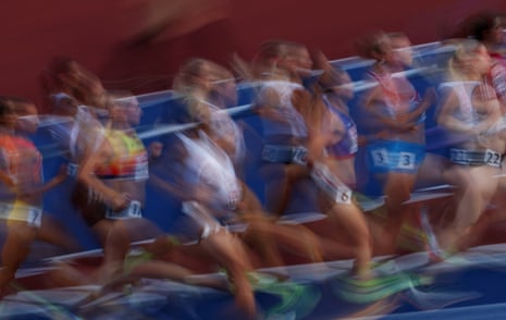 The competitors pound the track during the women's 5000m final.