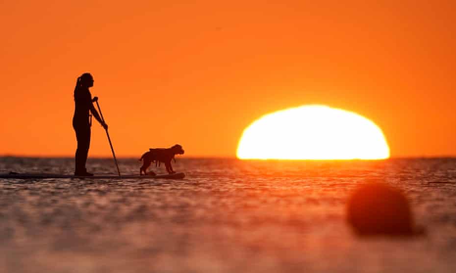 paddleboarding at sunrise in Cullercoats Bay, North Tyneside