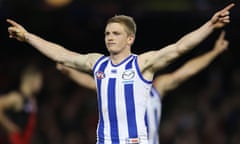 Jack Ziebell of the Kangaroos celebrates a goal to seal the win over Essendon at Etihad Stadium.