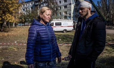 Bogdan Havelov and his mother Olga near the destroyed high-rise building in Asipenkavsky Zhitlamasov