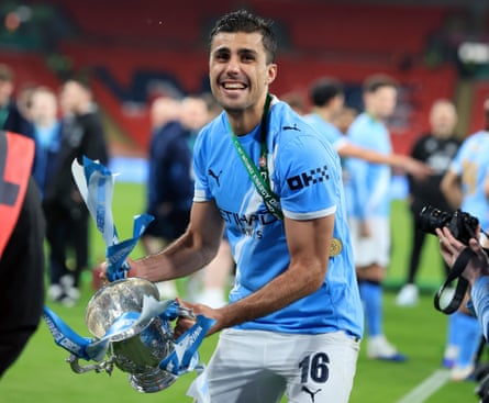 Rodri shows off the Carabao Cup trophy after Wembley glory