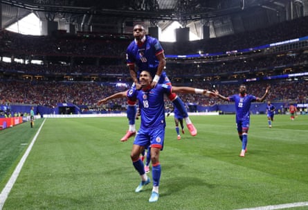 Haiti’s Wilson Isidor celebrates scoring their 2nd extremity pinch Lenny Joseph.
