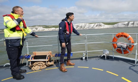 Rishi Sunak, right, onboard the Border Agency’s HMC Seeker, with the director of Small Boats Operational Command, Duncan Capps, off Dover on Monday.