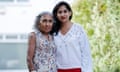 Minreet Kaur in a white blouse and red trousers (right) with her mother in a floral sleeveless blouse
