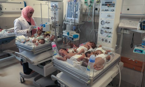 A Palestinian medic cares for premature babies evacuated from Gaza City's Al Shifa hospital ahead of their transfer from a hospital in Rafah to Egypt, on 20 November 2023.