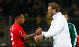 Juergen Klopp shakes hands with Nathaniel Clyne after the game.