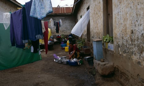 A woman performs chores at a home in Tanzania